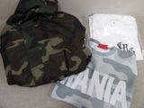 a camouflage bag, a t - shirt, and a camo bag on a couch