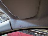 a view of the inside of a car from the driver ' s seat