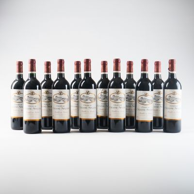 six bottles of red wine lined up in a row