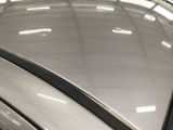 a reflection of a car in a mirror on the hood of a car