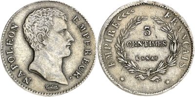 a silver coin with the head of a man on it