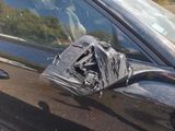 a bag on the side of a car door handle