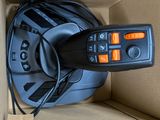 a remote control sitting in a box on the floor