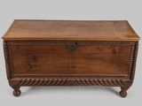 an old wooden chest with a metal latch on the top