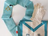 an image of a pair of gloves and an envelope on a table