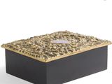 an image of a black and gold box on a white background