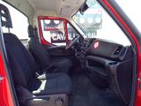 a red truck with black seats in the back of it
