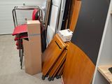 several pieces of furniture are stacked up in a garage