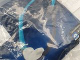 a plastic bag that has a pair of headphones on it