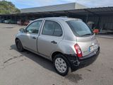 a silver car that is parked in a parking lot