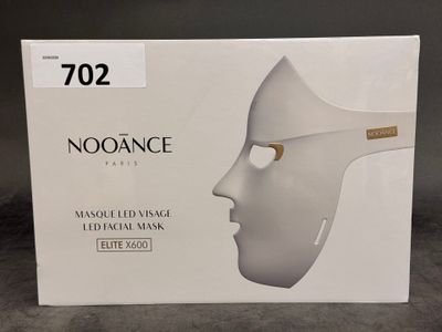 an image of a box with a white mask on top of it