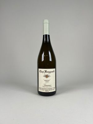 an image of a bottle of wine sitting on top of a table