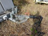 a machine that is sitting on the ground in the grass