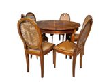 a wooden table with four chairs around it