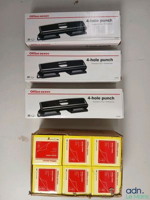 three boxes of office staplers are stacked on top of each other