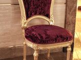 a chair that is sitting in the middle of a room