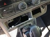 a car dashboard with a steering wheel and a dash board