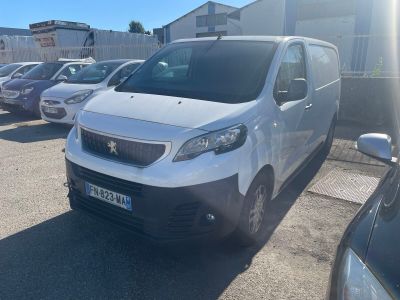the white van is parked in the parking lot next to other cars