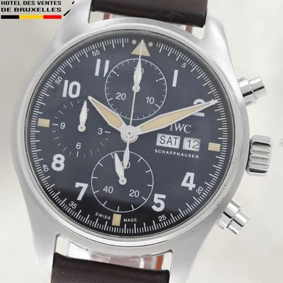 a close up of a watch with a leather strap