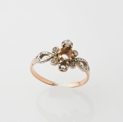 an image of a gold and diamond flower ring