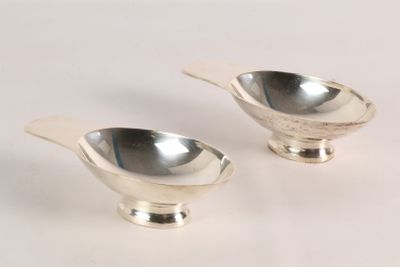 pair of silver plated salt and pepper shakers on a white background
