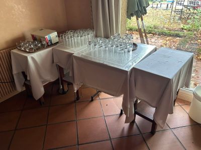 a table that has a lot of empty glasses on it