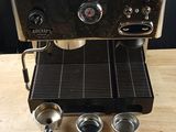 a coffee machine that is sitting on a wooden table