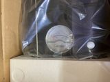 a plastic bag with a gauge in it sitting on a shelf