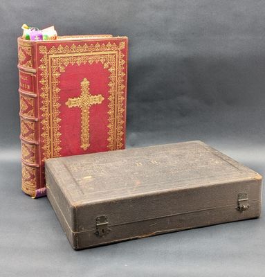 two old books sitting next to each other on a gray surface