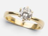 a close up of a diamond ring on a white background