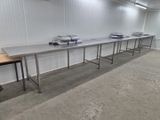 a long table that has a bunch of books on it