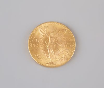 a gold coin with a picture of a woman on it