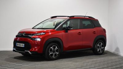 a red toyota c - hr is parked in a white room