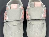 the new balance shoes are on a black surface