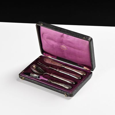 a box with silverware inside of it on a table