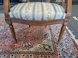 a chair that is sitting on a rug on the floor