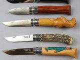 several different types of knives are lined up on a table