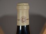 a bottle of wine that is sitting on a table