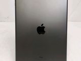 a close up of an apple ipad on a table with a white background