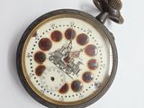 a clock that has a picture of a train on it