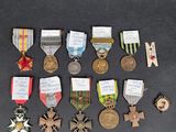 many medals that are on display on the table