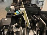 many computers on the desks in this office