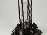 a candle holder that has a bunch of candles inside of it