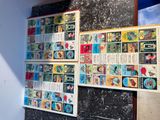 a lot of comics on the wall in this room