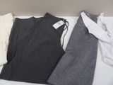 three pieces of clothing sitting on a table next to each other