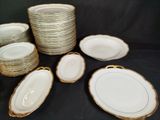 many plates and bowls that are sitting on a table