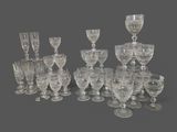 a lot of wine glasses that are sitting on the table