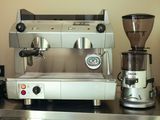 a coffee machine and a grinder on a counter