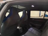 two seats in the back of a car that is parked
