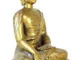 brass statue of a seated buddha on a white background